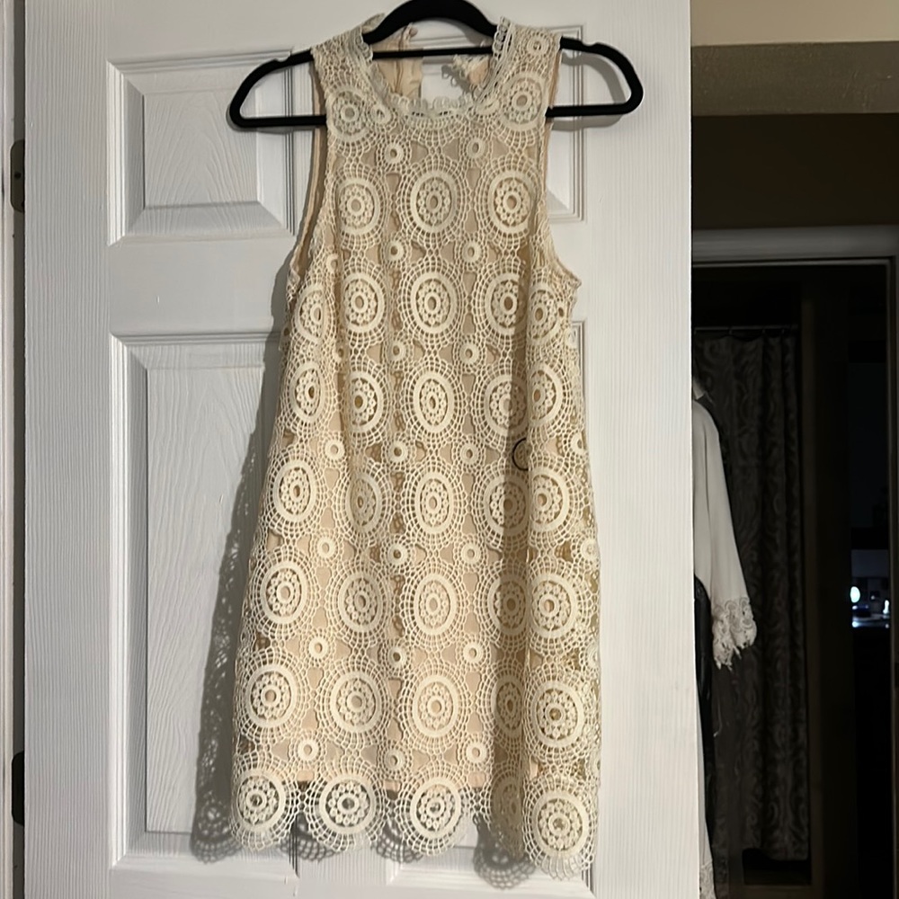 Free people sleeveless dress with beautiful details worn one time!